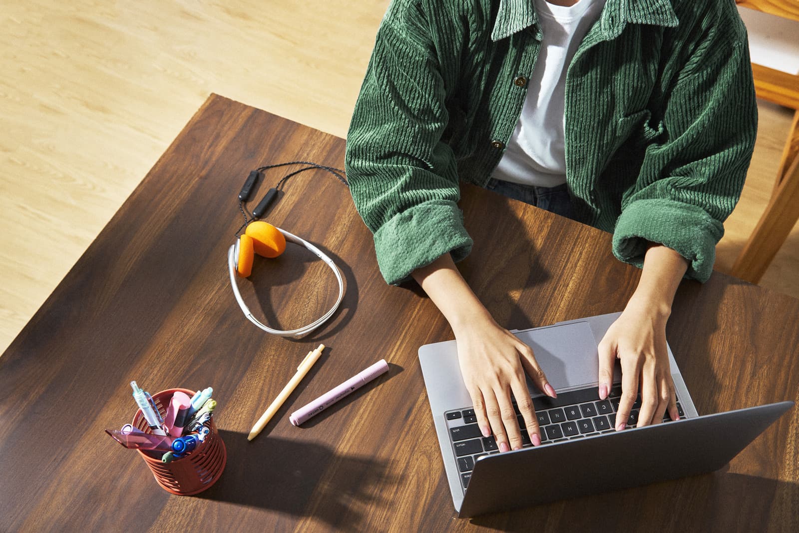 Person typing on a laptop at a desk